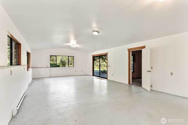 11451 O Ave, Anacortes, WA 98221 - empty room featuring concrete flooring, a baseboard heating unit, and lofted ceiling