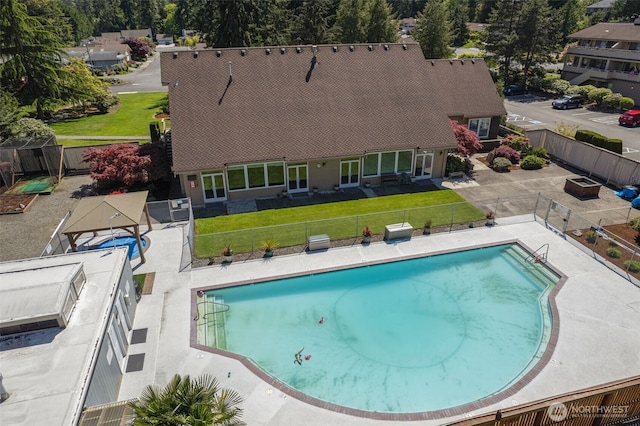 view of swimming pool featuring a patio area