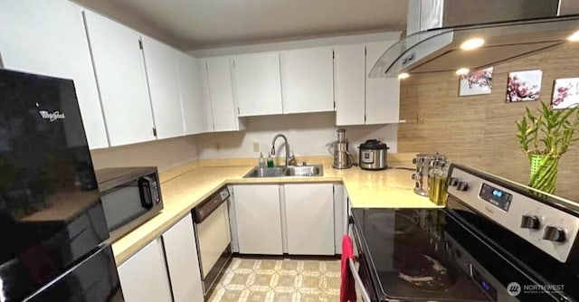 kitchen with stainless steel range with electric cooktop, a sink, light countertops, ventilation hood, and white cabinetry