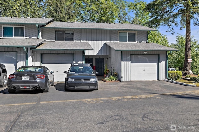 4008 S 158th St Unit J, Tukwila, WA 98188 - view of front facade featuring roof with shingles and driveway