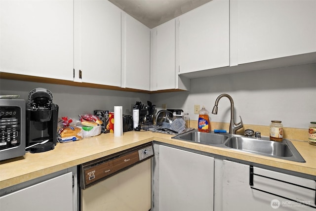 4008 S 158th St Unit J, Tukwila, WA 98188 - kitchen with light countertops, white cabinets, a sink, and dishwasher