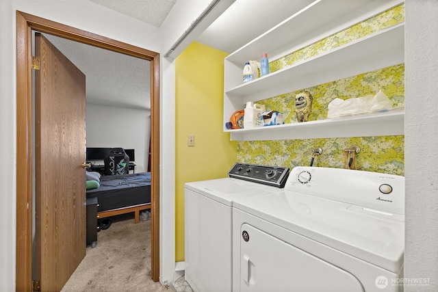 4008 S 158th St Unit J, Tukwila, WA 98188 - washroom with light colored carpet, laundry area, a textured ceiling, and washer and dryer