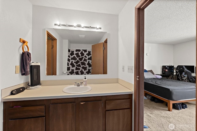 4008 S 158th St Unit J, Tukwila, WA 98188 - bathroom featuring vanity and a textured ceiling