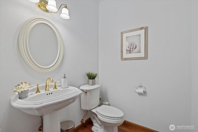 161 E Heron Cv, Shelton, WA 98584 - bathroom featuring baseboards, a sink, wood finished floors, and toilet