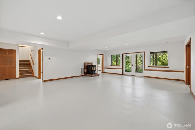 161 E Heron Cv, Shelton, WA 98584 - unfurnished living room featuring baseboards, recessed lighting, stairs, and finished concrete floors