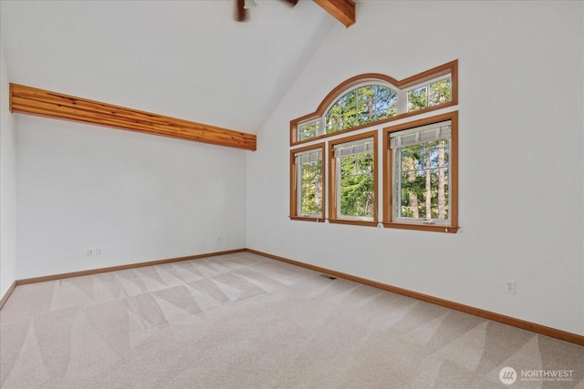 161 E Heron Cv, Shelton, WA 98584 - carpeted spare room featuring baseboards, beam ceiling, and high vaulted ceiling