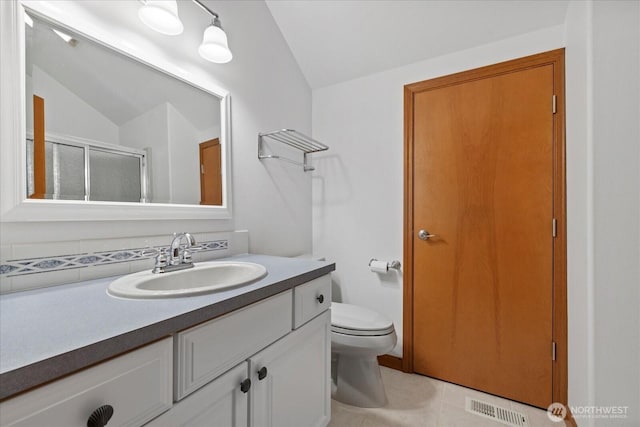 161 E Heron Cv, Shelton, WA 98584 - bathroom with visible vents, vanity, lofted ceiling, tile patterned floors, and a stall shower