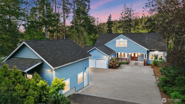 161 E Heron Cv, Shelton, WA 98584 - view of front of home featuring an attached garage, a porch, and driveway