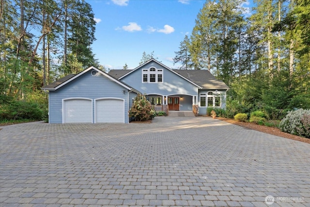 161 E Heron Cv, Shelton, WA 98584 - view of front of home with a porch, a garage, and decorative driveway