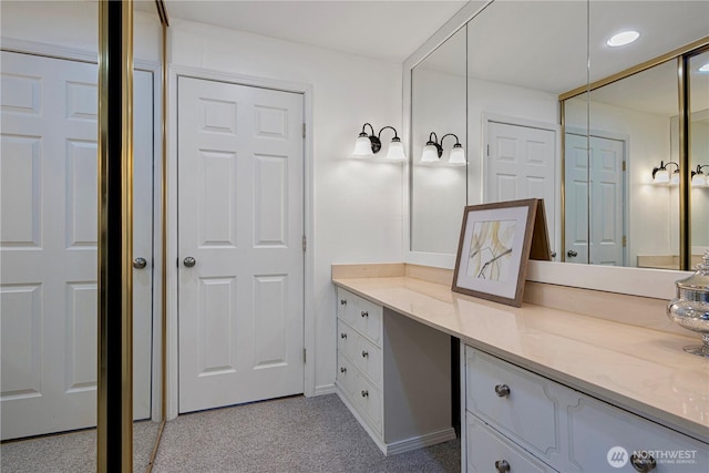 bathroom with recessed lighting and vanity