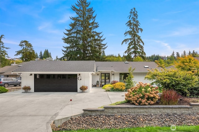 single story home with an attached garage and concrete driveway