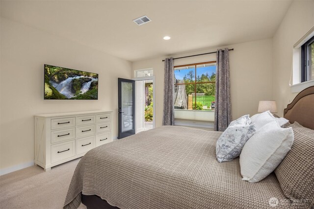 bedroom featuring light colored carpet, multiple windows, access to exterior, recessed lighting, and baseboards