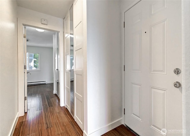 12429 NE 130th Ct Unit G201, Kirkland, WA 98034 - corridor with dark wood-style flooring, baseboards, and a baseboard radiator