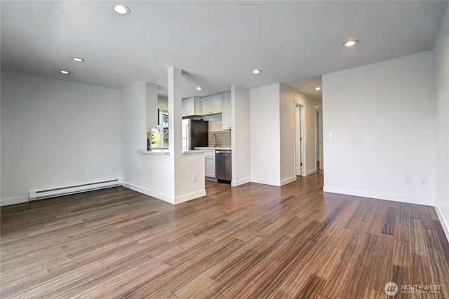 12429 NE 130th Ct Unit G201, Kirkland, WA 98034 - unfurnished living room featuring wood finished floors, baseboard heating, and recessed lighting
