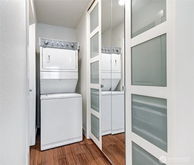 12429 NE 130th Ct Unit G201, Kirkland, WA 98034 - laundry area featuring laundry area, stacked washing maching and dryer, and wood finished floors