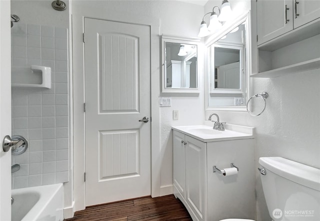12429 NE 130th Ct Unit G201, Kirkland, WA 98034 - full bath featuring bathtub / shower combination, toilet, wood finished floors, and vanity