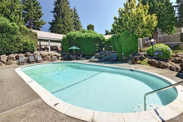 12429 NE 130th Ct Unit G201, Kirkland, WA 98034 - view of swimming pool featuring a fenced in pool and fence