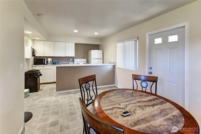 12429 NE 130th Ct Unit G201, Kirkland, WA 98034 - dining space with baseboards and recessed lighting
