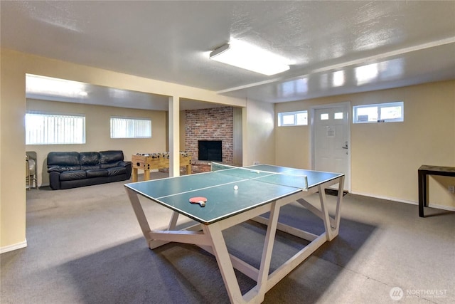 12429 NE 130th Ct Unit G201, Kirkland, WA 98034 - game room with a fireplace, carpet flooring, and baseboards