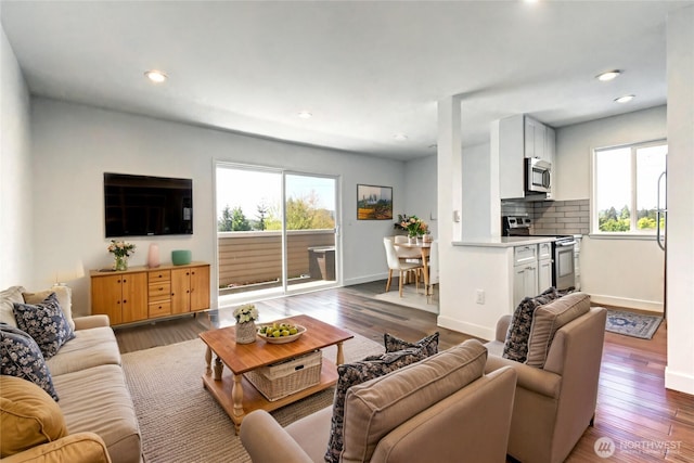 12429 NE 130th Ct Unit G201, Kirkland, WA 98034 - living room with wood finished floors, baseboards, and recessed lighting