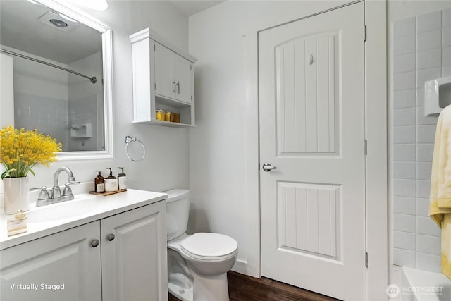 12429 NE 130th Ct Unit G201, Kirkland, WA 98034 - bathroom featuring toilet, a shower, wood finished floors, and vanity