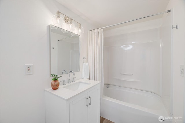 bathroom featuring vanity and shower / bathtub combination with curtain