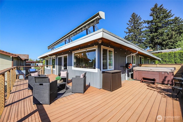 deck featuring a hot tub
