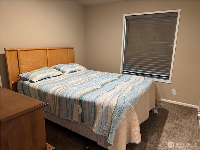 bedroom featuring carpet flooring and baseboards
