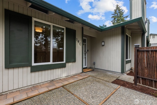 property entrance with fence