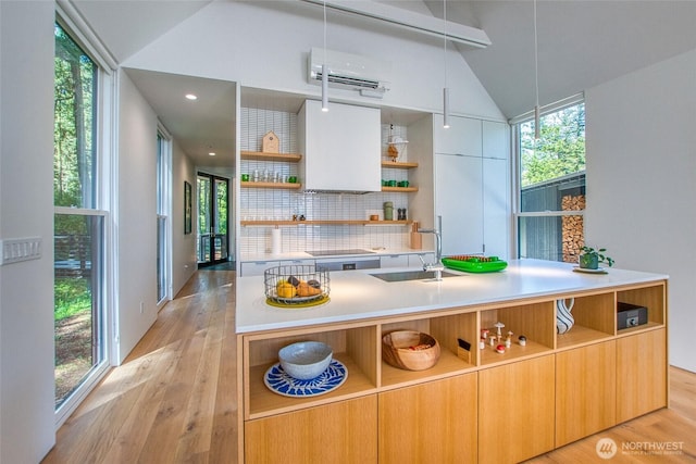 51 Lakshmi Rd, Orcas Island, WA 98245 - kitchen with open shelves, a sink, an AC wall unit, and modern cabinets