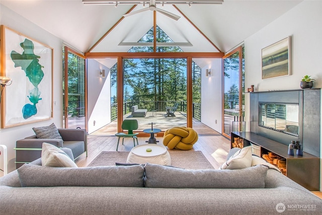 51 Lakshmi Rd, Orcas Island, WA 98245 - living room featuring wood finished floors, lofted ceiling, expansive windows, and ceiling fan