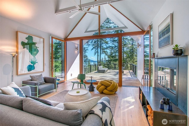 51 Lakshmi Rd, Orcas Island, WA 98245 - living area with plenty of natural light, wood finished floors, expansive windows, and high vaulted ceiling