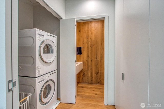 51 Lakshmi Rd, Orcas Island, WA 98245 - laundry room featuring stacked washer / dryer and light wood finished floors