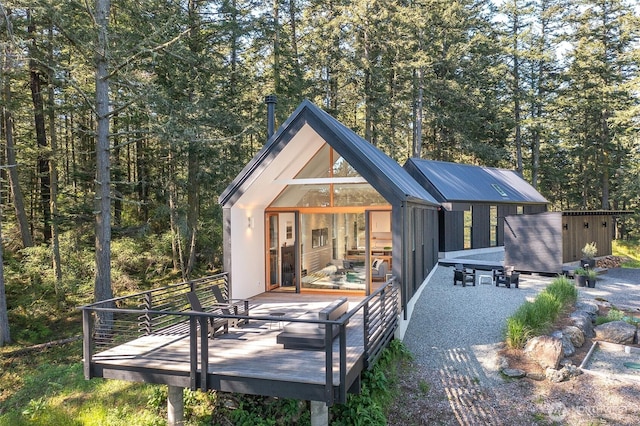 51 Lakshmi Rd, Orcas Island, WA 98245 - rear view of property featuring an outdoor structure and a deck