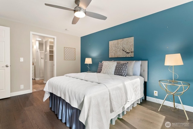 bedroom featuring baseboards, a ceiling fan, connected bathroom, and wood finished floors