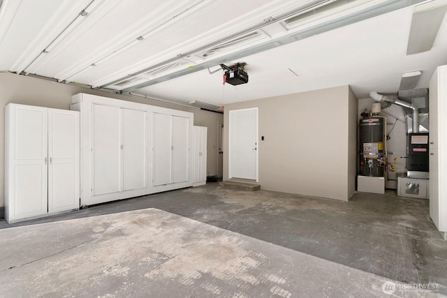 garage with a garage door opener, heating unit, and secured water heater