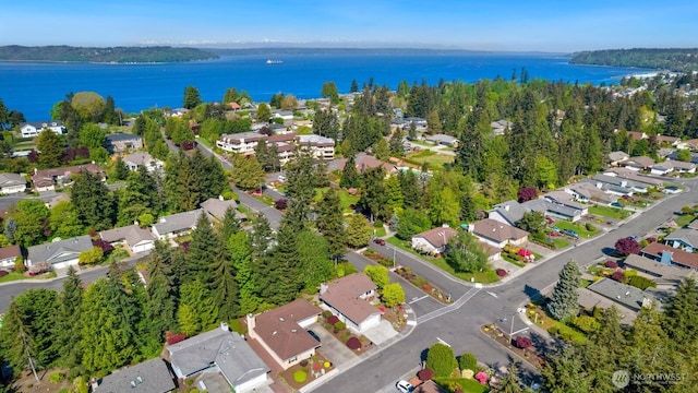 bird's eye view featuring a water view and a residential view