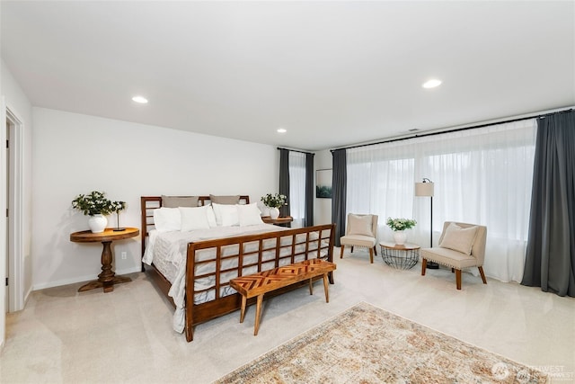 bedroom featuring recessed lighting, baseboards, and light colored carpet