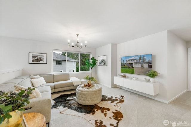 living room with baseboards, an inviting chandelier, and light carpet