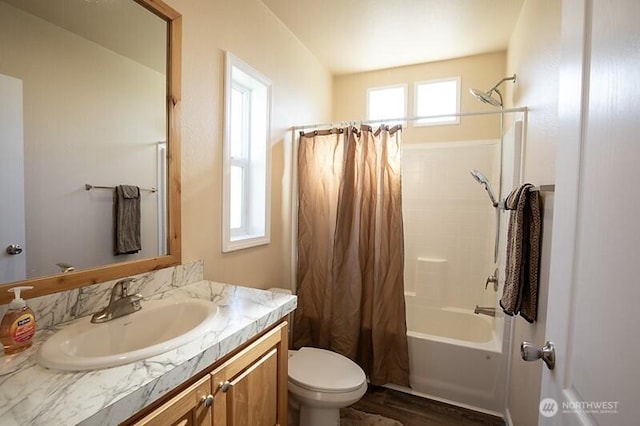 bathroom with vanity, shower / tub combo with curtain, wood finished floors, and toilet
