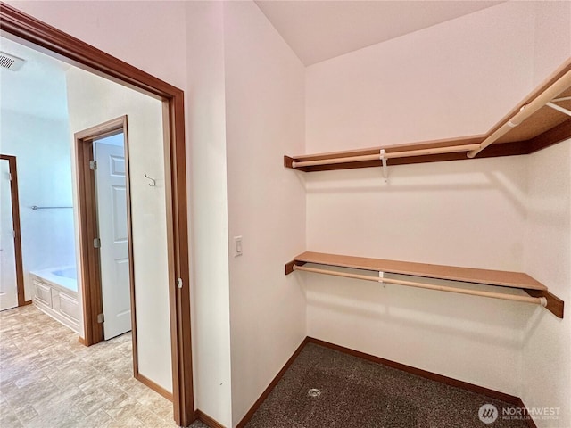 walk in closet featuring visible vents