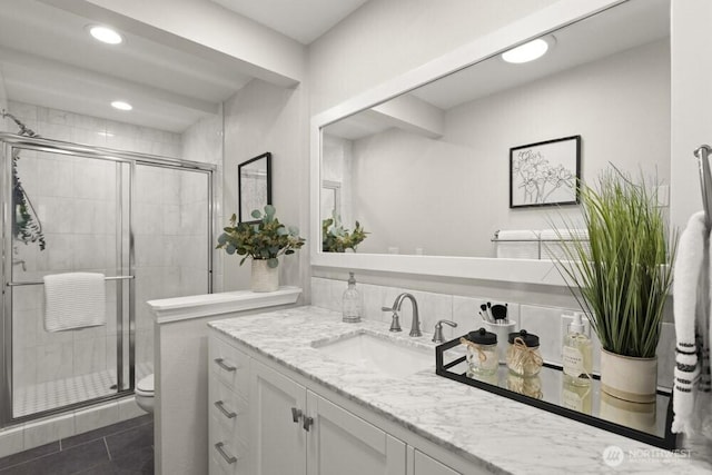 10121 Crescent Valley Dr NW, Gig Harbor, WA 98332 - bathroom with toilet, a stall shower, vanity, recessed lighting, and tile patterned flooring