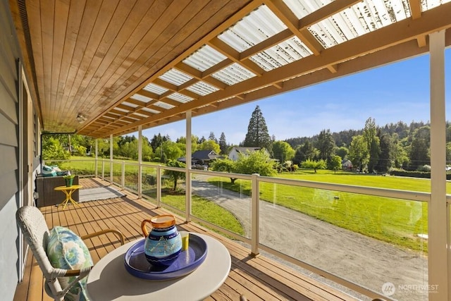 10121 Crescent Valley Dr NW, Gig Harbor, WA 98332 - sunroom / solarium featuring view of scattered trees