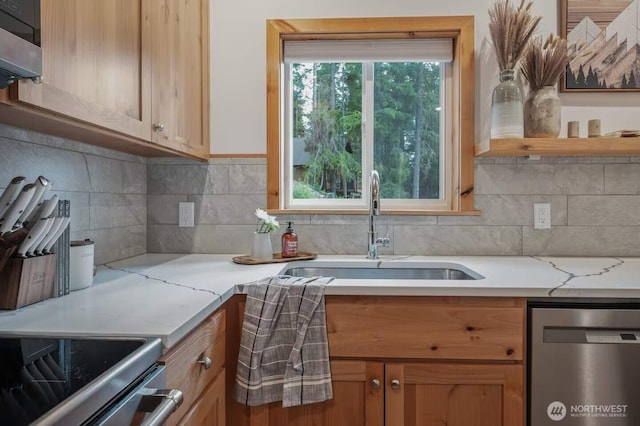 41 Hawkeye, Ronald, WA 98940 - kitchen with a sink, range hood, light stone countertops, backsplash, and dishwasher