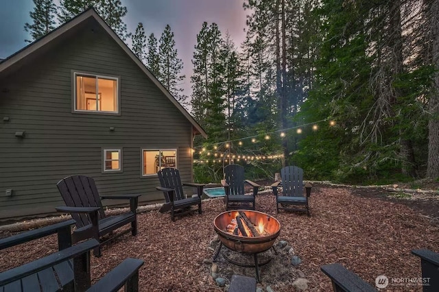 41 Hawkeye, Ronald, WA 98940 - back of property at dusk featuring an outdoor fire pit
