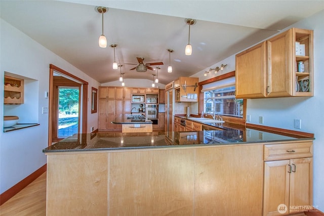 97 Snowberry Ln, Orcas Island, WA 98245 - kitchen featuring stainless steel appliances, vaulted ceiling, a ceiling fan, dark stone countertops, and a peninsula