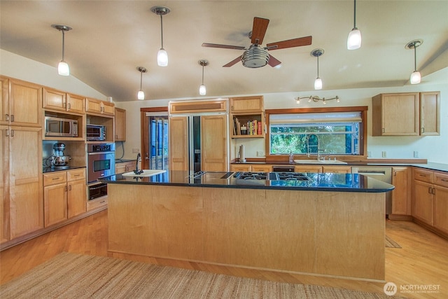97 Snowberry Ln, Orcas Island, WA 98245 - kitchen featuring built in appliances, a warming drawer, lofted ceiling, light wood-type flooring, and dark countertops
