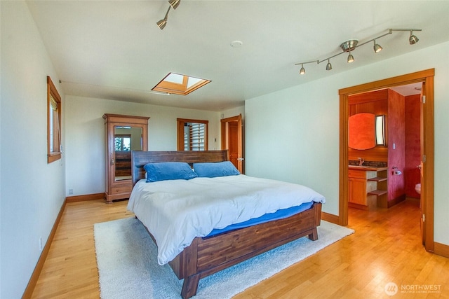 97 Snowberry Ln, Orcas Island, WA 98245 - bedroom featuring light wood finished floors and a skylight