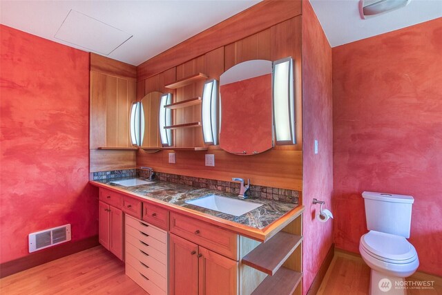 97 Snowberry Ln, Orcas Island, WA 98245 - bathroom with wood finished floors and double vanity