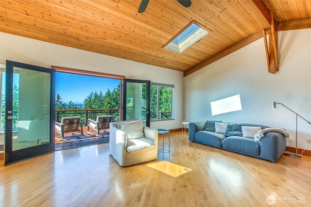 97 Snowberry Ln, Orcas Island, WA 98245 - living room with a skylight, a wood ceiling with exposed beams, hardwood / wood-style floors, high vaulted ceiling, and ceiling fan